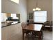 Dining room with a view into the kitchen at 4933 Village Gardens Dr # 211, Sarasota, FL 34234
