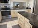 Updated kitchen with granite countertop and stainless appliances at 4933 Village Gardens Dr # 211, Sarasota, FL 34234