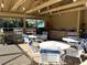 Community outdoor kitchen and dining area with grills at 4933 Village Gardens Dr # 211, Sarasota, FL 34234