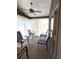 Comfortable enclosed patio space with ceiling fan at 4933 Village Gardens Dr # 211, Sarasota, FL 34234