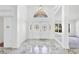 Bright foyer with marble floors, elegant doors, and classic chandelier at 4942 Hidden Oaks Ln, Sarasota, FL 34232