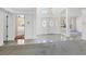 Elegant foyer with marble flooring, arched window, and double front doors with ornate glass at 4942 Hidden Oaks Ln, Sarasota, FL 34232