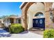 Close up of the home's brick archway and elegant double door entry at 4942 Hidden Oaks Ln, Sarasota, FL 34232
