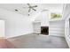 Bright living room with fireplace, built in shelving, and vaulted ceilings at 4942 Hidden Oaks Ln, Sarasota, FL 34232