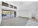 Light-filled living space with sliding doors that open up to the pool at 4942 Hidden Oaks Ln, Sarasota, FL 34232