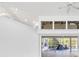 Bright open space with a vaulted ceiling, multiple windows, and access to the pool at 4942 Hidden Oaks Ln, Sarasota, FL 34232