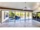 Relaxing patio features a pool with a waterfall, creating a peaceful retreat for outdoor enjoyment at 4942 Hidden Oaks Ln, Sarasota, FL 34232