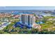 Aerial view of the high rise building, pool, and harbor in the distance at 501 Haben Blvd # 202, Palmetto, FL 34221