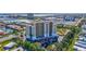 Aerial view of the high rise building, parking, and surrounding community at 501 Haben Blvd # 202, Palmetto, FL 34221
