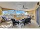 Comfortable covered balcony with fan, outdoor seating, and beautiful views at 501 Haben Blvd # 202, Palmetto, FL 34221