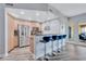 Modern kitchen with stainless steel appliances, breakfast bar, and blue bar stools at 501 Haben Blvd # 202, Palmetto, FL 34221
