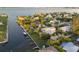 Beautiful waterfront home with private boat dock, manicured lawn and vibrant tropical landscaping, perfect for relaxing at 504 59Th St, Holmes Beach, FL 34217