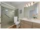 Well-lit bathroom with a glass-enclosed shower, neutral tile, and modern vanity at 504 59Th St, Holmes Beach, FL 34217