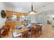 Dining room with an archway to the living room, hardwood flooring, and lots of natural light at 504 59Th St, Holmes Beach, FL 34217