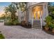 Elegant front entry with stone steps, mature landscaping and ample parking at 504 59Th St, Holmes Beach, FL 34217