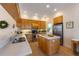 Well-lit kitchen with stainless steel appliances, an island, and lots of cabinet space for modern cooking at 504 59Th St, Holmes Beach, FL 34217