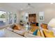 Bright living room featuring hardwood floors, large windows, and comfortable seating at 504 59Th St, Holmes Beach, FL 34217