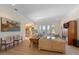 Spacious living room with neutral tones, wood floors, and views to the outside with access to the dining area at 504 59Th St, Holmes Beach, FL 34217