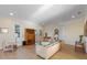 Open living room with neutral tones, wood floors, and lots of natural light creates a bright and welcoming space at 504 59Th St, Holmes Beach, FL 34217