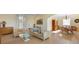 Spacious living room flows into the dining area, featuring wood floors and neutral tones for seamless entertaining at 504 59Th St, Holmes Beach, FL 34217