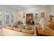 Bright living room features neutral tones, wood floors and an open and airy atmosphere with lots of natural light at 504 59Th St, Holmes Beach, FL 34217