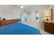 Airy main bedroom showing entry to staircase and bathroom with a calming color palette at 504 59Th St, Holmes Beach, FL 34217