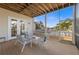 Screened porch with outdoor seating overlooking water at 504 59Th St, Holmes Beach, FL 34217