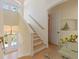 Bright entryway with high ceilings features a staircase with wood steps and natural light from the front doors at 504 59Th St, Holmes Beach, FL 34217