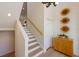 Bright staircase with wooden steps, white risers, and a natural wood handrail leads to the upper level at 504 59Th St, Holmes Beach, FL 34217