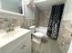 Updated bathroom with tiled shower and modern vanity at 5104 Silver Bell Dr, Port Charlotte, FL 33948