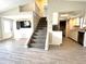 Entryway featuring stairs leading to second story and an open concept kitchen and Gathering room at 5104 Silver Bell Dr, Port Charlotte, FL 33948