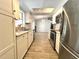 Bright kitchen featuring stainless steel appliances, light granite countertops, and ample cabinet space at 5104 Silver Bell Dr, Port Charlotte, FL 33948