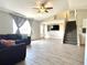 Inviting living room featuring a staircase, tile floors, a ceiling fan, and backyard access at 5104 Silver Bell Dr, Port Charlotte, FL 33948