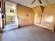 Empty paneled room with linoleum flooring is connected to the laundry room at 5104 Silver Bell Dr, Port Charlotte, FL 33948