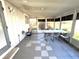 Sunroom featuring checkerboard flooring, surrounded by plenty of natural light at 5104 Silver Bell Dr, Port Charlotte, FL 33948