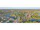 Scenic aerial view showcasing community layout with ponds and lush landscaping at 5203 Rushmere Ct, Palmetto, FL 34221