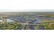 Scenic aerial view showcasing community layout with ponds and lush landscaping at 5203 Rushmere Ct, Palmetto, FL 34221