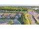 Beautiful aerial view of a home featuring a well-manicured lawn and proximity to nearby amenities at 5203 Rushmere Ct, Palmetto, FL 34221