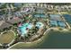 An aerial view of community amenities, including tennis courts, a pool, and a clubhouse at 5203 Rushmere Ct, Palmetto, FL 34221