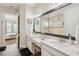 Bathroom featuring double sinks with granite countertops and a walk-in shower at 5203 Rushmere Ct, Palmetto, FL 34221