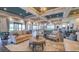 A view of a clubhouse interior with large tables and comfortable seating for residents and their guests at 5203 Rushmere Ct, Palmetto, FL 34221