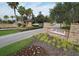 Stone community entrance sign amid lush landscaping, showcasing the Esplanade at Artisan Lakes at 5203 Rushmere Ct, Palmetto, FL 34221