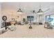 Bright kitchen boasts a large island, granite countertops, pendant lighting and views to the living and dining areas at 5203 Rushmere Ct, Palmetto, FL 34221