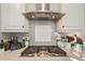 This kitchen features stainless steel appliances, light grey subway tile, and white shaker cabinets at 5203 Rushmere Ct, Palmetto, FL 34221