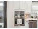 This kitchen features stainless steel appliances, white shaker cabinets, and a tile backsplash at 5203 Rushmere Ct, Palmetto, FL 34221