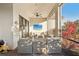 Screened lanai with brick flooring, ceiling fan and outdoor seating area at 5203 Rushmere Ct, Palmetto, FL 34221