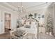 Bright main bedroom featuring a Christmas tree, decor, and an ensuite bathroom at 5203 Rushmere Ct, Palmetto, FL 34221