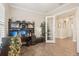 Office featuring a storage cabinet, a window with plantation shutters, and an entryway at 5203 Rushmere Ct, Palmetto, FL 34221