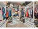 Spacious walk-in closet featuring custom shelving, drawers, and ample hanging space at 5203 Rushmere Ct, Palmetto, FL 34221