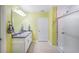 Clean bathroom featuring double sinks, white cabinetry, a large mirror, and a glass-enclosed shower at 566 Corrientes Cir, Punta Gorda, FL 33983